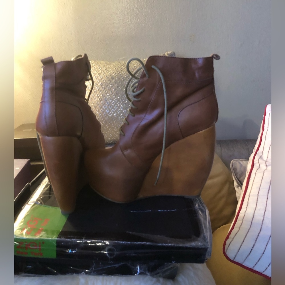 Brown platform lace up ankle boots.